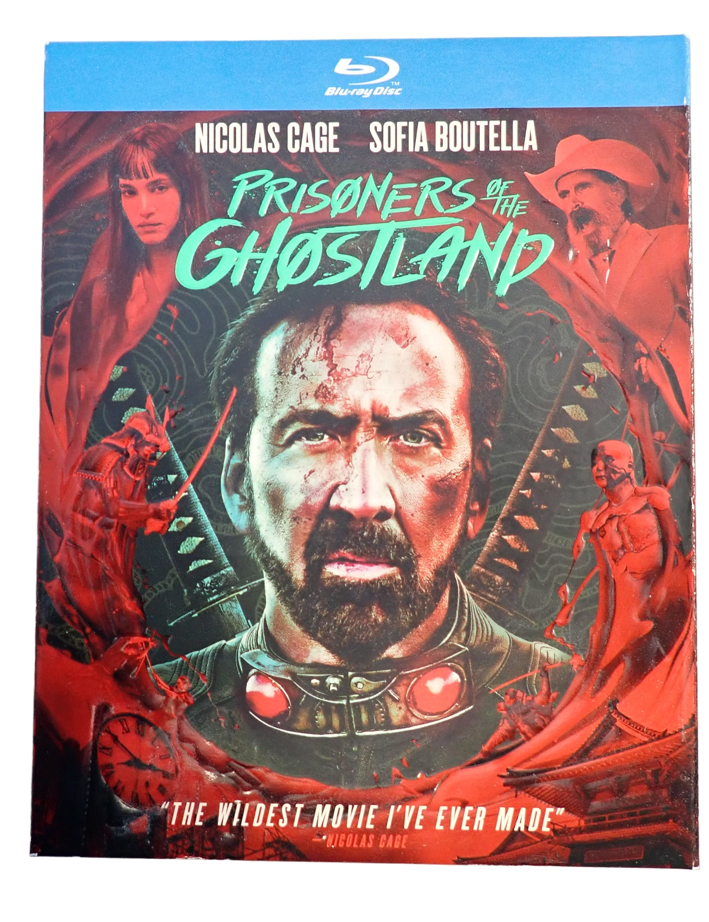 Blu-ray cover of 'Prisoners of the Ghostland' with Nicolas Cage and Sofia Boutella on a gray background